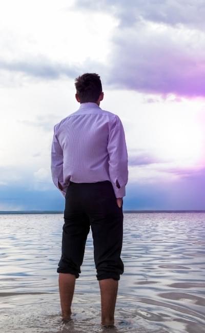 man standing in peaceful water